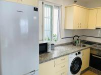 Kuchyňa alebo kuchynka v ubytovaní Apartamento Ría Punta Umbría