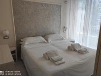 Łóżko lub łóżka w pokoju w obiekcie Casa Vacanze Medit