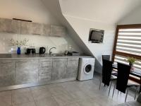 Kuchyň nebo kuchyňský kout v ubytování Apartament Jastarnia