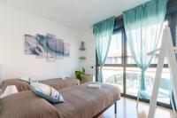 Posteľ alebo postele v izbe v ubytovaní Dock of the Bay Genova, Stylish Apartment in the Heart of Genoa with Air Conditioning, Private free Garage, Harbour View