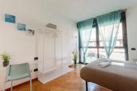 Posteľ alebo postele v izbe v ubytovaní Dock of the Bay Genova, Stylish Apartment in the Heart of Genoa with Air Conditioning, Private free Garage, Harbour View