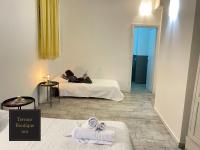 A bed or beds in a room at Terrace Boutique Inn