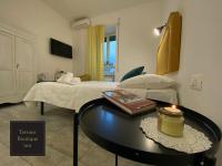 A bed or beds in a room at Terrace Boutique Inn