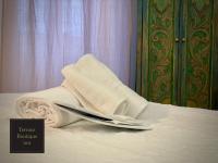 A bed or beds in a room at Terrace Boutique Inn