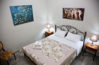Postel nebo postele na pokoji v ubytování Villa Maria Kefalonia