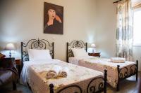 Postel nebo postele na pokoji v ubytování Villa Maria Kefalonia