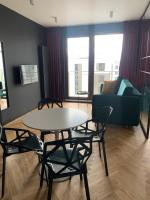 Televízia a/alebo spoločenská miestnosť v ubytovaní Apartamenty Wola Goleszowska