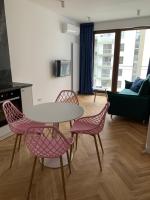 Televízia a/alebo spoločenská miestnosť v ubytovaní Apartamenty Wola Goleszowska