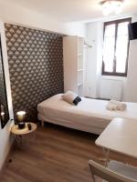 A bed or beds in a room at Hotel renaissance martigues