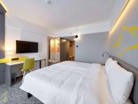 Televízia a/alebo spoločenská miestnosť v ubytovaní ibis Styles Nowy Targ