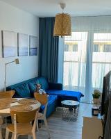 Televízia a/alebo spoločenská miestnosť v ubytovaní La Riva Mia Apartamenty