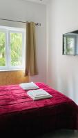 A bed or beds in a room at The Roof Garden - Bed&Breakfast