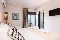 Posteľ alebo postele v izbe v ubytovaní Artemisia Residence