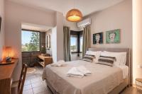 Posteľ alebo postele v izbe v ubytovaní Artemisia Residence