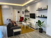 Televízia a/alebo spoločenská miestnosť v ubytovaní Apartamentos Cantarería, Azahar