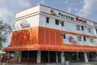 Un edificio con un cartel al costado. en MORNINGS HOTEL, en Sungai Petani