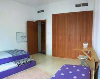 Postel nebo postele na pokoji v ubytování Octavius Holiday Home, Large 2 Bedroom Apartment near Global Village & Outlet Mall