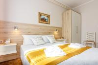 Posteľ alebo postele v izbe v ubytovaní Apartments Franelić