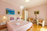 Posteľ alebo postele v izbe v ubytovaní Apartments Franelić