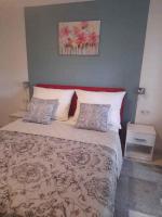 Posteľ alebo postele v izbe v ubytovaní Szalai Apartman