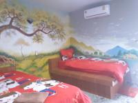 Postel nebo postele na pokoji v ubytování สิชล บ้านอุ๊ รีสอร์ท