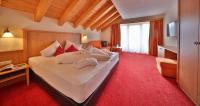 Łóżko lub łóżka w pokoju w obiekcie Noldis Hotel