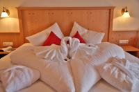 Łóżko lub łóżka w pokoju w obiekcie Noldis Hotel