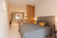 Postel nebo postele na pokoji v ubytování Apartamentos Málaga Premium - Calle Granada