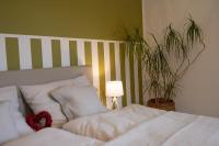 A bed or beds in a room at Villa Bella Vista - Apartment Green