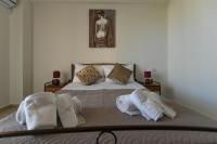 Posteľ alebo postele v izbe v ubytovaní Orama Apartments - Vacations Next to the Sea