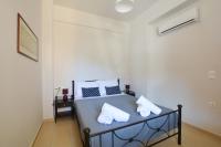 Posteľ alebo postele v izbe v ubytovaní Orama Apartments - Vacations Next to the Sea