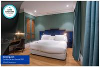 A bed or beds in a room at Soho Boutique Congreso