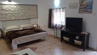 TV a/nebo společenská místnost v ubytování Apartments Janjac