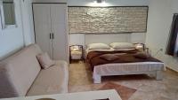 Postel nebo postele na pokoji v ubytování Apartments Janjac