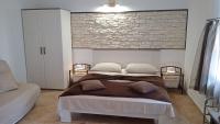 Postel nebo postele na pokoji v ubytování Apartments Janjac
