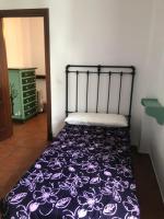 Posteľ alebo postele v izbe v ubytovaní Casa de Tita Dolores