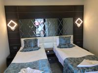 Postel nebo postele na pokoji v ubytování Venus Hotel