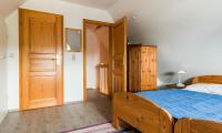 Postel nebo postele na pokoji v ubytování Ahrenshooper Landhaus 04