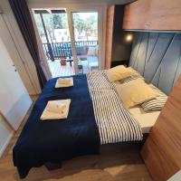 Posteľ alebo postele v izbe v ubytovaní BIOGRAD MOBILE HOME OASIS