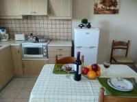 Kuchyň nebo kuchyňský kout v ubytování Riza Falasarna Apartments