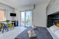 Posteľ alebo postele v izbe v ubytovaní Studio Baldo - Brenzone Holiday Apartments