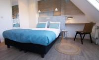 Loods Hotel Vlielandにあるベッド