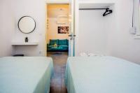 A bed or beds in a room at Avocado villa offering peace and relaxation