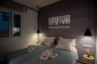 A bed or beds in a room at Avocado villa offering peace and relaxation