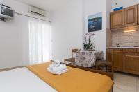 Postel nebo postele na pokoji v ubytování Apartments Erceg