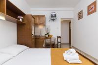 Postel nebo postele na pokoji v ubytování Apartments Erceg