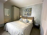 A bed or beds in a room at Blue House Varenna