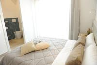 A bed or beds in a room at Il Granaio di Rossetti Elisabetta