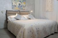 A bed or beds in a room at Blue House Varenna