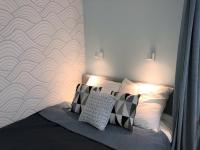 Posteľ alebo postele v izbe v ubytovaní Apartament Blisko Morza i Parku Gdańsk Brzeźno